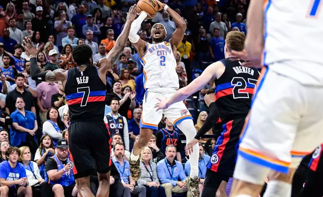 Oklahoma City Thunder guard Shai Gilgeous-Alexander (2) shoots against Detroit Pistons forward Paul Reed (7) during the second half of an NBA basketball game Monday, March. 30, 2026, in Oklahoma City. (AP Photo/Gerald Leong)