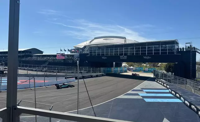 Indy NXT cars drive through Turn 1 during a practice session at ATT Stadium, Friday, March 13, in Arlington, Texas. (Associated Press/Stephen Hawkins)