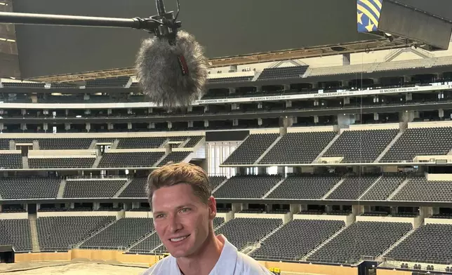 IndyCar driver Josef Newgarden answers questions during a media session inside ATT Stadium, Friday, March 13, in advance of the Grand Prix of Arlington on a temporary street course outside the stadium, which is also being prepared for hosting nine World Cup soccer matches later this year, in Arlington, Texas. (Associated Press/Stephen Hawkins)