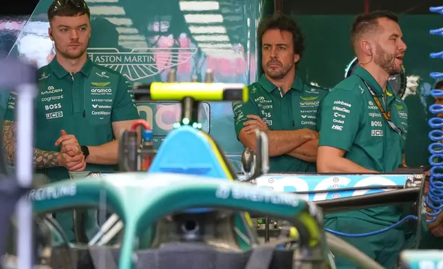 Aston Martin driver Fernando Alonso of Spain waits in his team garage ahead of the first practice session for the Australian Formula One Grand Prix at Albert Park, in Melbourne, Australia, Friday, March 6, 2026. (AP Photo/Asanka Brendon Ratnayake)