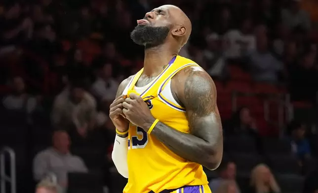 Los Angeles Lakers forward LeBron James reacts after the Lakers defeated the Miami Heat in an NBA basketball game, Thursday, March 19, 2026, in Miami. (AP Photo/Lynne Sladky)