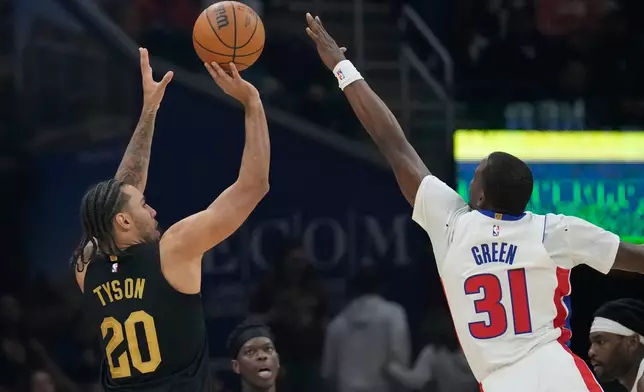 Cleveland Cavaliers guard Jaylon Tyson (20) shoots over Detroit Pistons guard Javonte Green (31) in the second half of an NBA basketball game in Cleveland, Tuesday, March 3, 2026. (AP Photo/Sue Ogrocki)