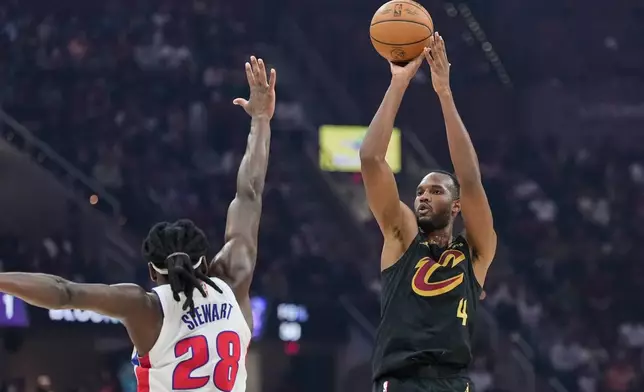 Cleveland Cavaliers center Evan Mobley (4) shoots as Detroit Pistons forward Isaiah Stewart (28) defends in the first half of an NBA basketball game in Cleveland, Tuesday, March 3, 2026. (AP Photo/Sue Ogrocki)
