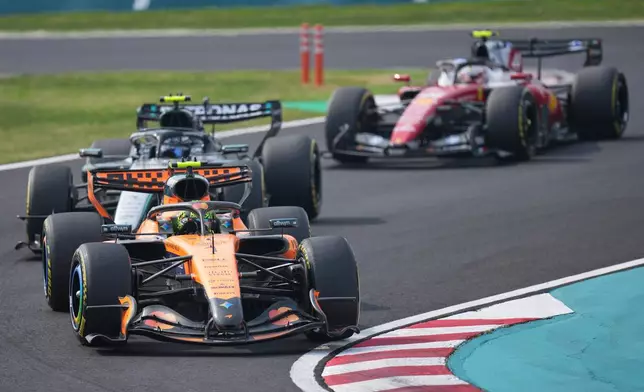 McLaren driver Lando Norris of Britain leads Mercedes driver Kimi Antonelli of Italy during the Japanese Formula One Grand Prix at Suzuka in central Japan, Sunday, March 29, 2026. (AP Photo/Hiro Komae) CORRECTION: Drivers name corrected to Lando Norris