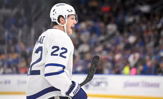 Toronto Maple Leafs' Jake McCabe (22) reacts after scoring a goal during the third period of an NHL hockey game against the St. Louis Blues' Saturday, March 28, 2026, in St. Louis. (AP Photo/Connor Hamilton)