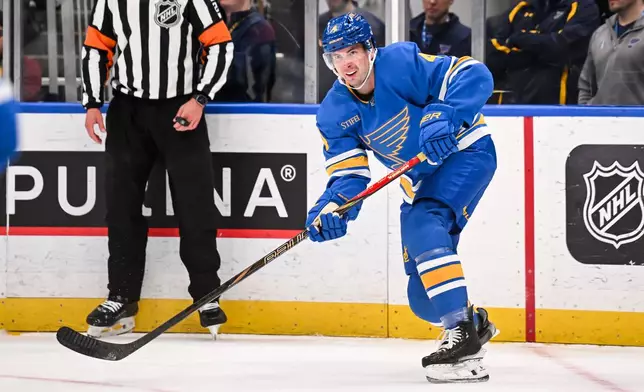 St. Louis Blues' Justin Holl (4) in action during the third period of an NHL hockey game against the Toronto Maple Leafs Saturday, March 28, 2026, in St. Louis. (AP Photo/Connor Hamilton)