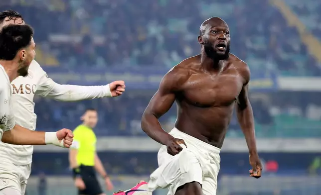 Napoli's Romelu Lukaku, right, celebrates after scoring his side's second goal during the Serie A soccer match between Hellas Verona and Napoli in Verona, Italy, Saturday, Feb. 28, 2026. (Paola Garbuio/LaPresse via AP)