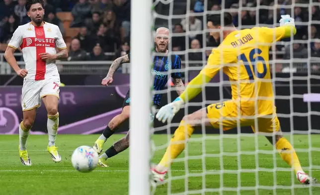 Inter Milan's Federico Dimarco, center, scores his side's opening goal during the Serie A soccer match between Inter Milan and Genoa in Milan, Italy, Saturday, Feb. 28, 2026. (AP Photo/Antonio Calanni)