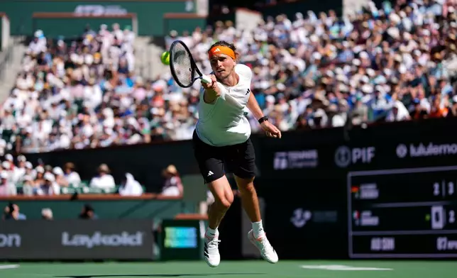 Alexander Zverev, of Germany, returns a shot against Jannik Sinner, of Italy, during a semifinal match at the BNP Paribas Open tennis tournament, Saturday, March 14, 2026, in Indian Wells, Calif. (AP Photo/Mark J. Terrill)