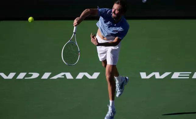Daniil Medvedev, of Russia, serves against Carlos Alcaraz, of Spain, during a semifinal match at the BNP Paribas Open tennis tournament, Saturday, March 14, 2026, in Indian Wells, Calif. (AP Photo/Mark J. Terrill)