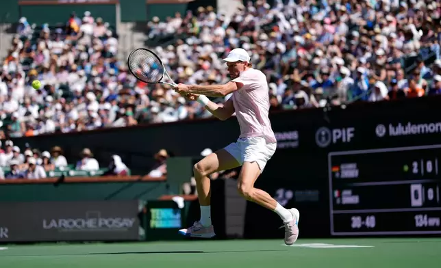 Jannik Sinner, of Italy, returns a shot against Alexander Zverev, of Germany, during a semifinal match at the BNP Paribas Open tennis tournament, Saturday, March 14, 2026, in Indian Wells, Calif. (AP Photo/Mark J. Terrill)