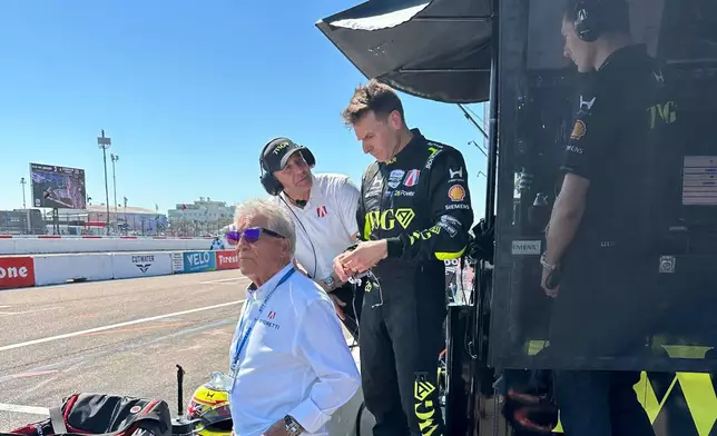 Will Power watches the IndyCar race on pit lane after hitting the wall in his debut for Andretti Global on Sunday, March 1, 2026 in St. Petersburg, Fla. (AP Photo/Jenna Fryer)