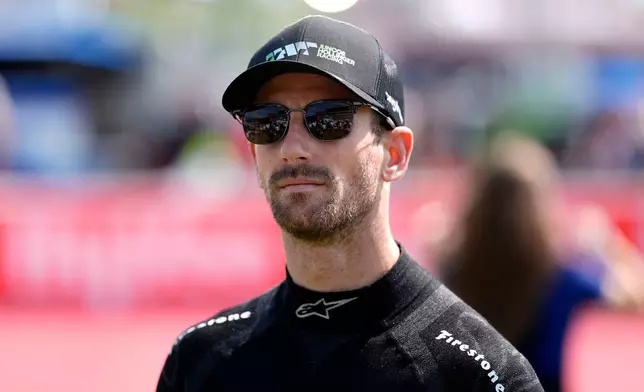 FILE - Romain Grosjean walks to driver introductions before an IndyCar auto race, Sunday, July 14, 2024, at Iowa Speedway in Newton, Iowa. (AP Photo/Charlie Neibergall, File)