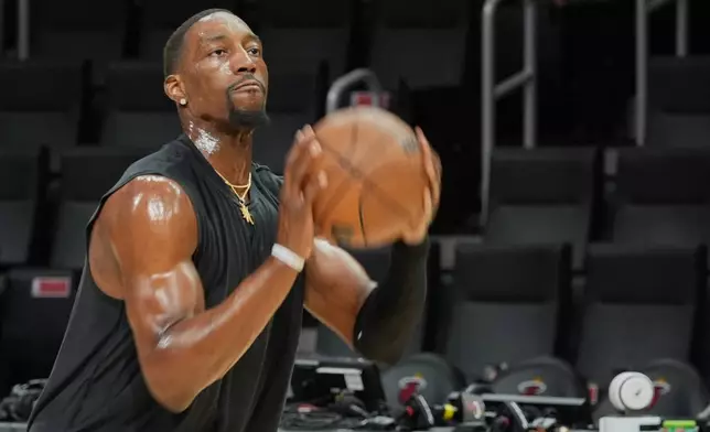 Miami Heat center Bam Adebayo warms up before a game against the Milwaukee Bucks Thursday, March 12, 2026, in Miami. (AP Photo/Marta Lavandier)