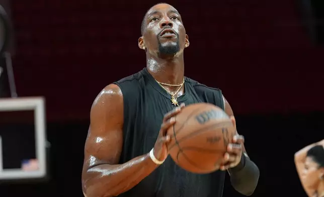 Miami Heat center Bam Adebayo warms up before a game against the Milwaukee Bucks Thursday, March 12, 2026, in Miami. (AP Photo/Marta Lavandier)