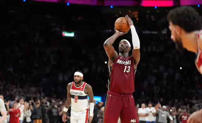 Miami Heat center Bam Adebayo (13) shoots a free throw to reach 83 points, the second-highest single game total in NBA history, in the second half of an NBA basketball game against the Washington Wizards, Tuesday, March 10, 2026, in Miami. (AP Photo/Rebecca Blackwell)