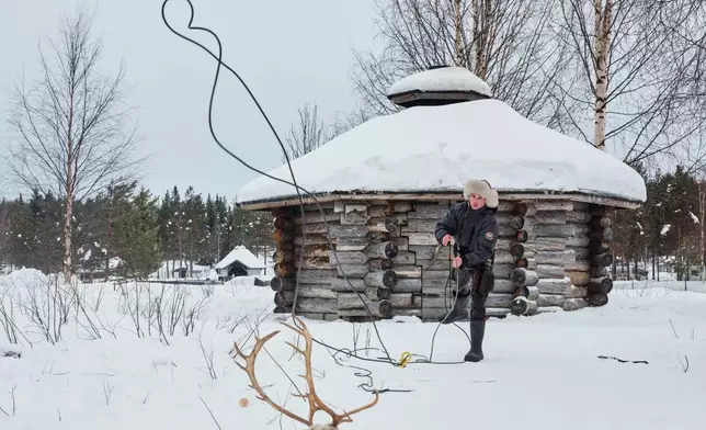 Young reindeer herder Antti-Akseli Pohtila practices throwing a suopunki, a traditional reindeer lasso, during the Salla Porocup reindeer sprint racing event in Salla, Finland, March 8, 2026. (AP Photo/Aino Vaananen)
