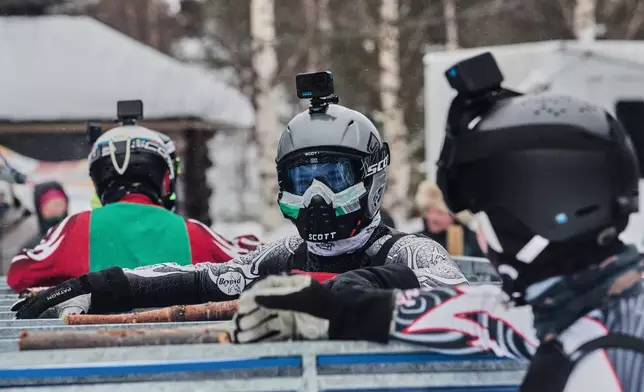 Jonne Mikkola, center, and other mushers wait in the starting gates for their reindeer to be loaded before a heat at the Salla Porocup reindeer sprint racing event in Salla, Finland, March 8, 2026. (AP Photo/Aino Vaananen)