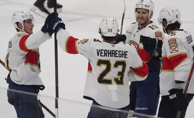 Florida Panthers center Carter Verhaeghe (23) celebrates his goal during the third period of an NHL hockey game against the Detroit Red Wings, Tuesday, March 10, 2026, in Sunrise, Fla. (AP Photo/Marta Lavandier)
