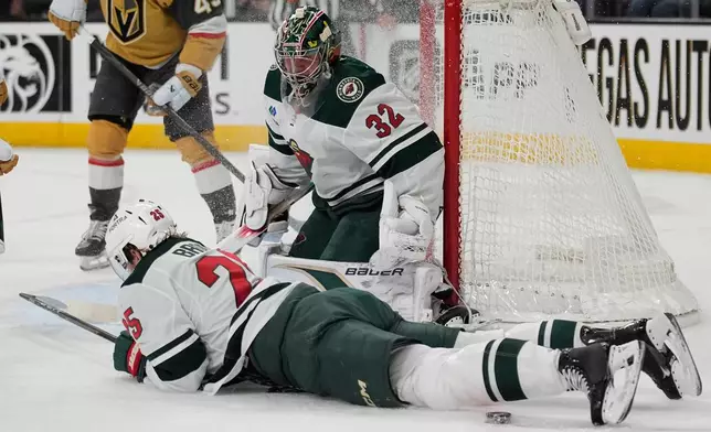 Minnesota Wild defenseman Jonas Brodin (25) stops a pass attempt by the Vegas Golden Knights during the second period of an NHL hockey game Friday, March 6, 2026, in Las Vegas. (AP Photo/John Locher)