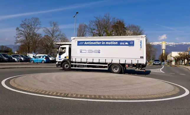 A truck carries the transportable antimatter trap during a road test at the European Organization for Nuclear Research (CERN), in Meyrin near Geneva, Switzerland, Tuesday, March 24, 2026. (Salvatore Di Nolfi/Keystone via AP)