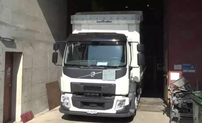 This image, taken from video, shows a truck transporting antiprotons in a first-ever test drive to study antimatter at the European Organization for Nuclear Research, CERN, in Meyrin, near Geneva, Switzerland, March 24, 2026. (AP Photo/Jamey Keaten)