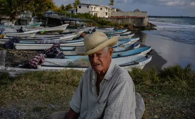Fisherman Roberto Santos sits on the shore after suspending fishing because of an oil spill in the Gulf of Mexico that authorities said originated from an unidentified vessel and two natural oil seeps in Salinas, Mexico, Thursday, March 26, 2026. (AP Photo/Felix Marquez)