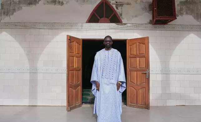 Ababacar Mboup, an activist against homosexuality and founder of And Samm Jikko Yi or "Together for the Preservation of Values," poses for a portrait in front of a mosque in Guediawaye, Senegal, Sunday, March 8, 2026. (AP Photo/Misper Apawu)