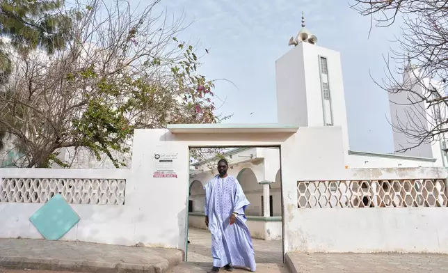 Ababacar Mboup, an activist against homosexuality and founder of And Samm Jikko Yi or "Together for the Preservation of Values," walks out of a mosque in Guediawaye, Senegal, Sunday, March 8, 2026. (AP Photo/Misper Apawu)