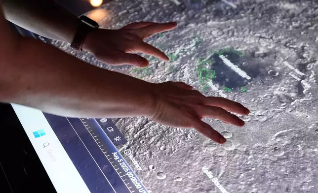 Crew lunar observations lead Sara Schmidt demonstrates software at Johnson Space Center on Thursday, July 24, 2025, in Houston. (AP Photo/Ashley Landis)