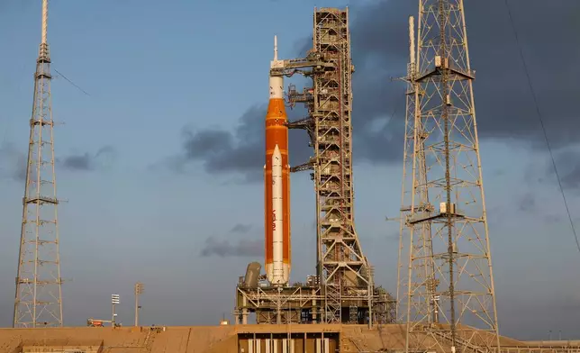 NASA's Artermis II moon rocket sits on Launch Pad 39-B at the Kennedy Space Center at sunrise Sunday, March 29, 2026, in Cape Canaveral, Fla. (AP Photo/Terry Renna)