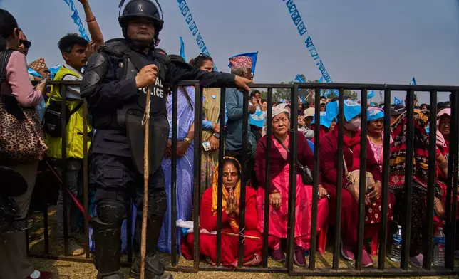 Supporters of the Rastriya Swatantra Party wait for the arrival of rapper-turned-politician Balendra Shah during an election campaign rally in Chitwan, approximately 180 kilometers (112 miles) west of Kathmandu, Nepal, Friday, Feb. 27, 2026. (AP Photo/Niranjan Shrestha)