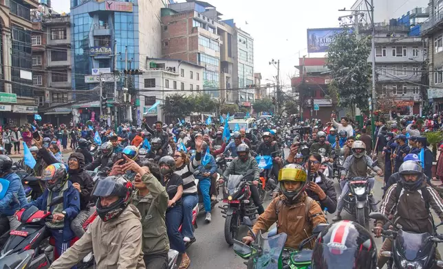 Rastriya Swatantra Party supporters on motorcycles join prime ministerial candidate Balendra Shah, the former mayor of Kathmandu, during an election campaign rally in Lalitpur, Nepal, Saturday, Feb. 28, 2026. (AP Photo/Niranjan Shrestha)