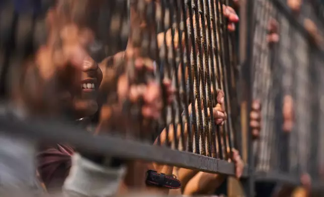 Supporters of the Rastriya Swatantra Party wait for the arrival of rapper-turned-politician Balendra Shah during an election campaign rally in Chitwan, approximately 180 kilometers (112 miles) west of Kathmandu, Nepal, Friday, Feb. 27, 2026. (AP Photo/Niranjan Shrestha)