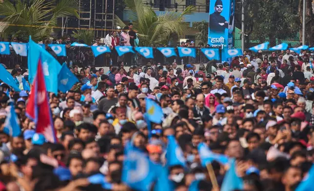 Supporters of the Rastriya Swatantra Party wait for the arrival of rapper-turned-politician Balendra Shah during an election campaign rally in Chitwan, approximately 180 kilometers (112 miles) west of Kathmandu, Nepal, Friday, Feb. 27, 2026. (AP Photo/Niranjan Shrestha)