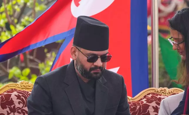 Nepal's youngest Prime Minister Balendra Shah signs after taking the oath of office at a function in Kathmandu, Nepal, Friday, March 27, 2026. (AP Photo/Niranjan Shrestha)