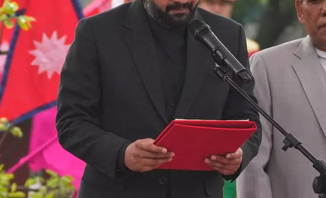 Nepal's youngest Prime Minister Balendra Shah takes the oath of office at a function in Kathmandu, Nepal, Friday, March 27, 2026. (AP Photo/Niranjan Shrestha)