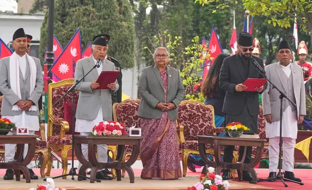 Nepal's youngest Prime Minister Balendra Shah, second right, takes the oath of office at a function in Kathmandu, Nepal, Friday, March 27, 2026. (AP Photo/Niranjan Shrestha)