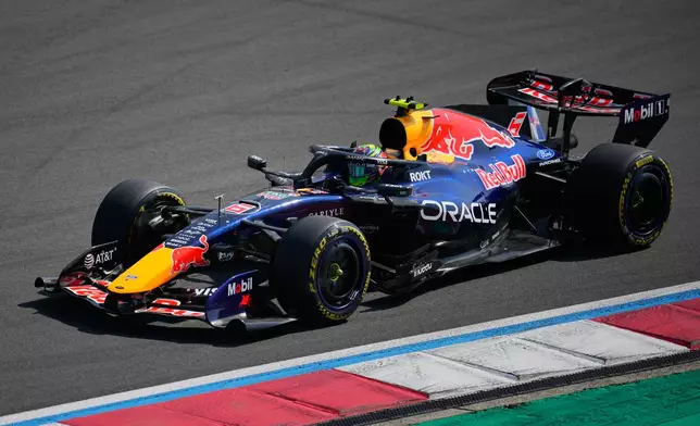 Red Bull driver Isack Hadjar of France steers his car during the Sprint Race of the Chinese Formula One Grand Prix at the Shanghai International Circuit, in Shanghai, China, Saturday, March 14, 2026. (AP Photo/Vincent Thian)