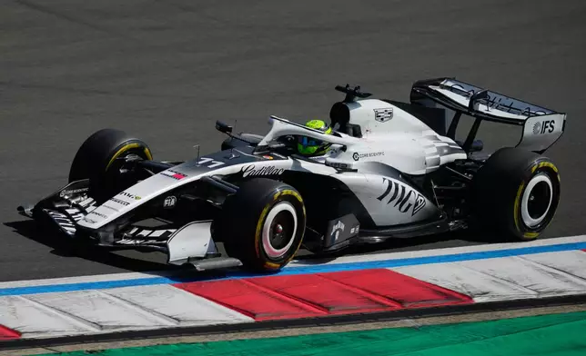 Cadillac driver Sergio Perez of Mexico steers his car during the Sprint Race of the Chinese Formula One Grand Prix at the Shanghai International Circuit, in Shanghai, China, Saturday, March 14, 2026. (AP Photo/Vincent Thian)