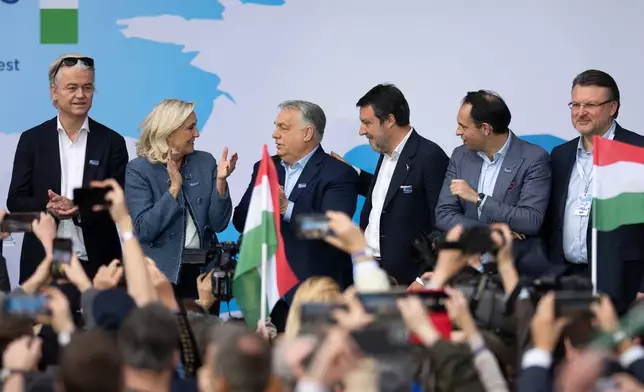 Hungarian Prime Minister Viktor Orbán, third from left, stands with, from left; Geert Wilders of the Netherlands, France's Marine Le Pen, Italy's Matteo Salvini, Belgium's Tom Van Grieken and Latvia's Ainārs Šlesers during an assembly of European far-right parties with Orbán’s Patriots for Europe group, in Budapest, Hungary, Monday, March 23, 2026. (AP Photo/Denes Erdos)