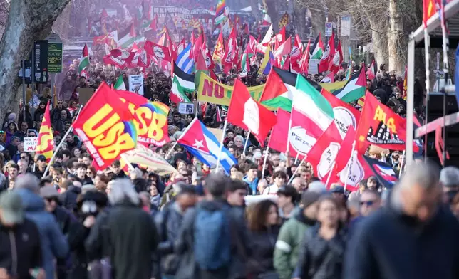 People take part in a national demonstration against the war in Iran and the March 22 referendum on the Italian justice system, in Rome, Saturday, March 14 2026. (AP Photo/Andrew Medichini)