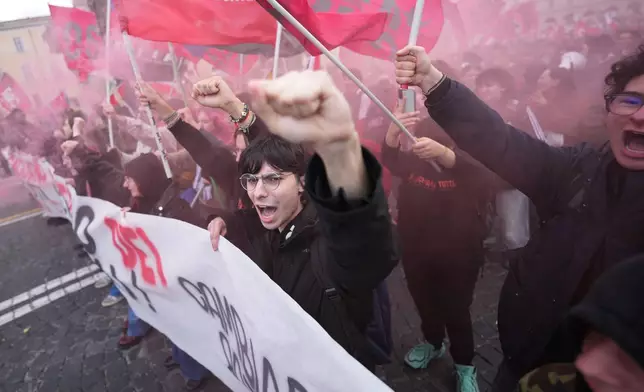 People take part in a national demonstration against the war in Iran and the March 22 referendum on the Italian justice system, in Rome, Saturday, March 14, 2026. (AP Photo/Andrew Medichini)