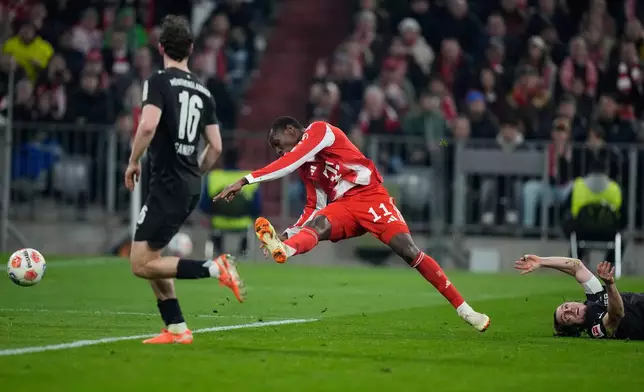 Bayern's Nicolas Jackson is fouled by Moenchengladbach's Rocco Reitz during the Bundesliga soccer match between FC Bayern Munich and Borussia Moenchengladbach in Munich, Germany, March 6, 2026. (AP Photo/Matthias Schrader)