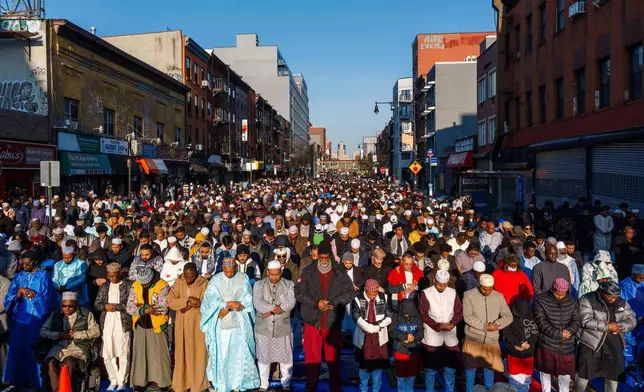 Muslim worshippers attend Eid al-Fitr prayer, Friday, March 20, 2026 in the Brooklyn Borough of New York. (AP Photo/Adam Gray)