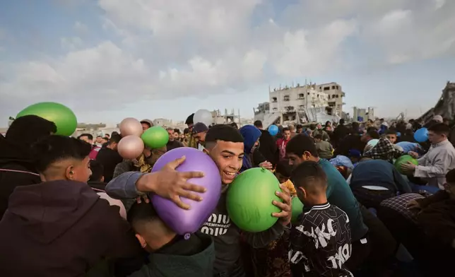 Palestinians celebrate Eid al-Fitr in Jabaliya, Gaza Strip, Friday, March 20, 2026. (AP Photo/Jehad Alshrafi)