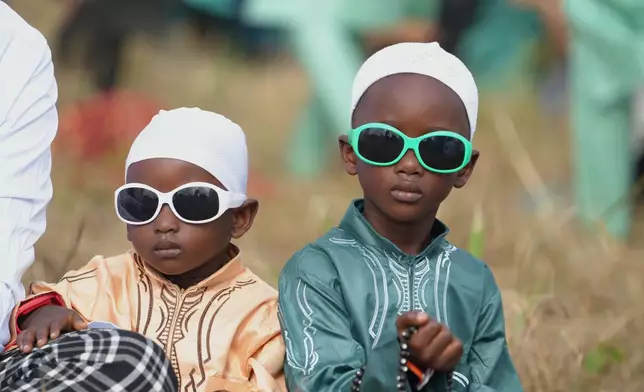 Muslim kids attend Eid al-Fitr prayers, marking the end of the fasting month of Ramadan in Lagos, Nigeria, Friday, March 20, 2026. (AP Photo/Sunday Alamba)