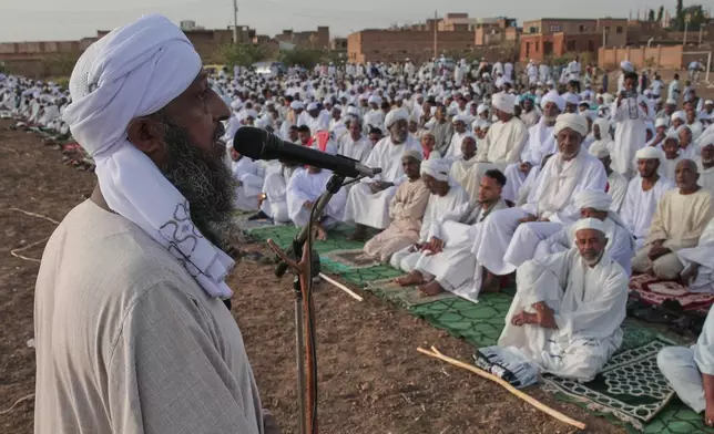 Sudanese gather for the Eid al-Fitr prayer, the Muslim holiday marking the end of Ramadan, Islam's holy month of fasting, in Khartoum, Sudan, Friday, March 20, 2026. (AP Photo/Marwan Ali)