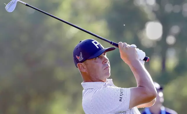 Gary Woodland watches his tee shot on the ninth hole during the first round of the Texas Children's Houston Open golf tournament Thursday, March 26, 2026, in Houston. (AP Photo/Michael Wyke)
