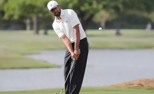 Tony Finau hits onto the 17th green during the first round of the Texas Children's Houston Open golf tournament Thursday, March 26, 2026, in Houston. (AP Photo/Michael Wyke)